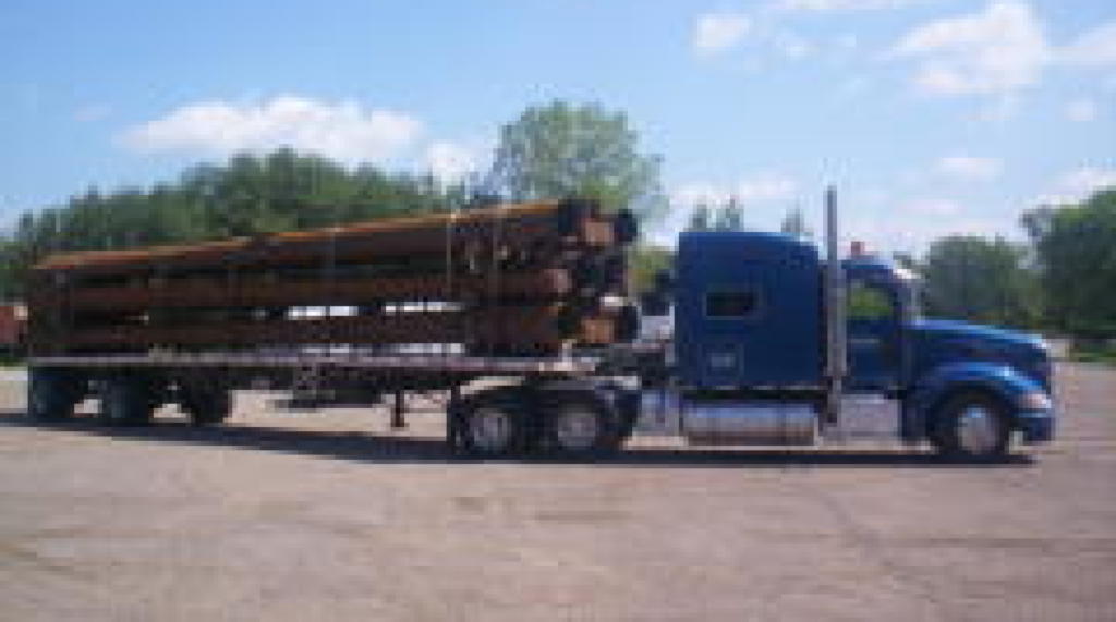 Flatbed semi-truck hauling in 48 USA states by Da-Ran, Inc.