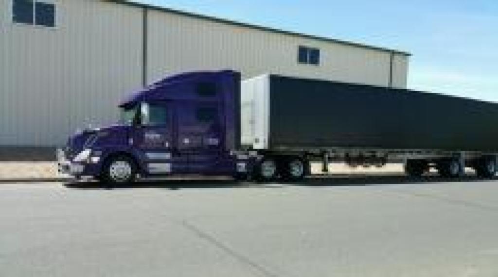 Conestoga semi-truck hauling by Da-Ran Inc, in USA 48 states and parts of canada